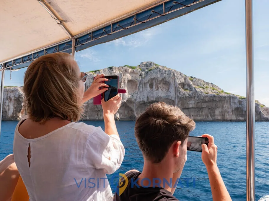 Guests photographing the cliffs from Plava Laguna
